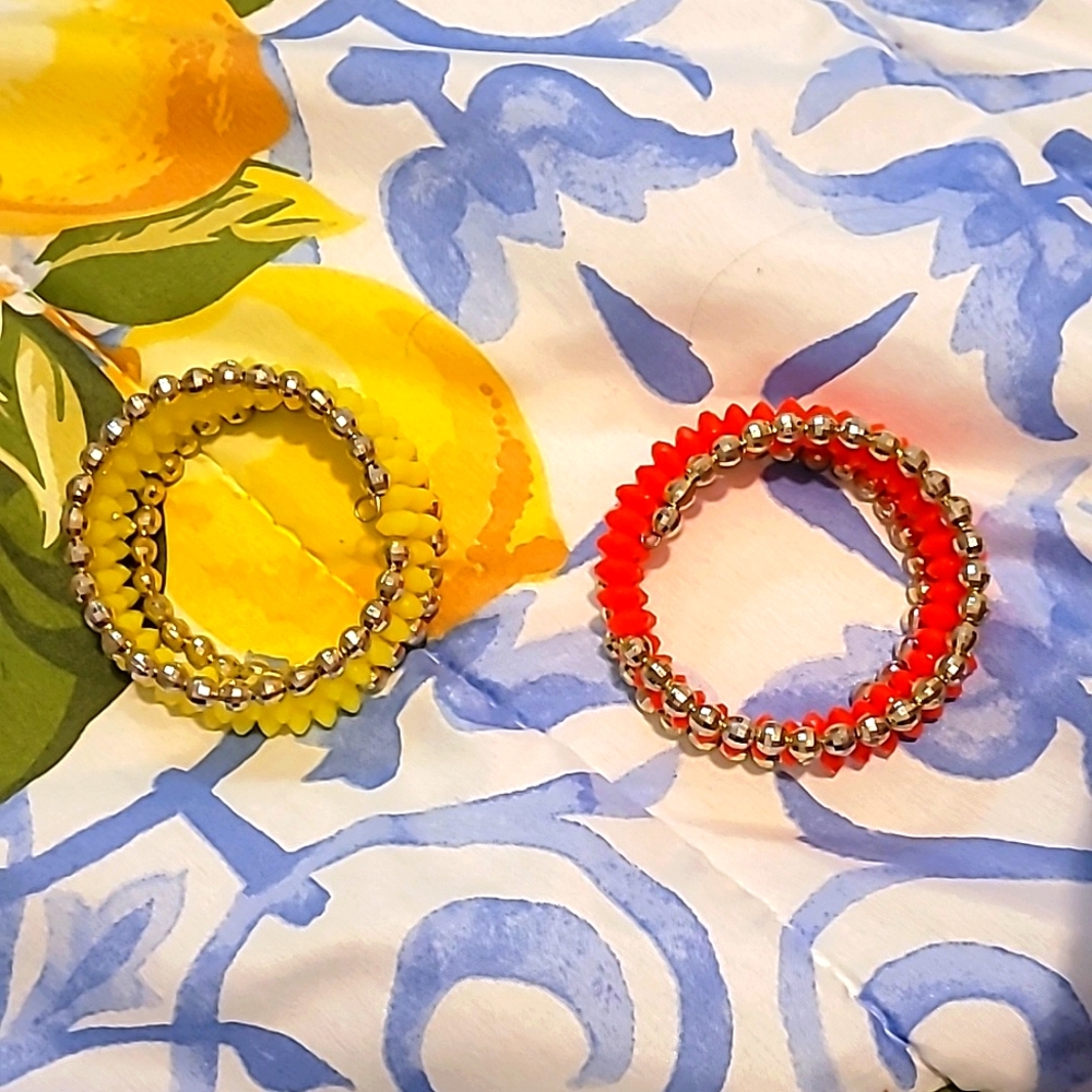 BRAND NEW! Neon yellow and neon pinkish orange spiral bracelets. 2 for $5.